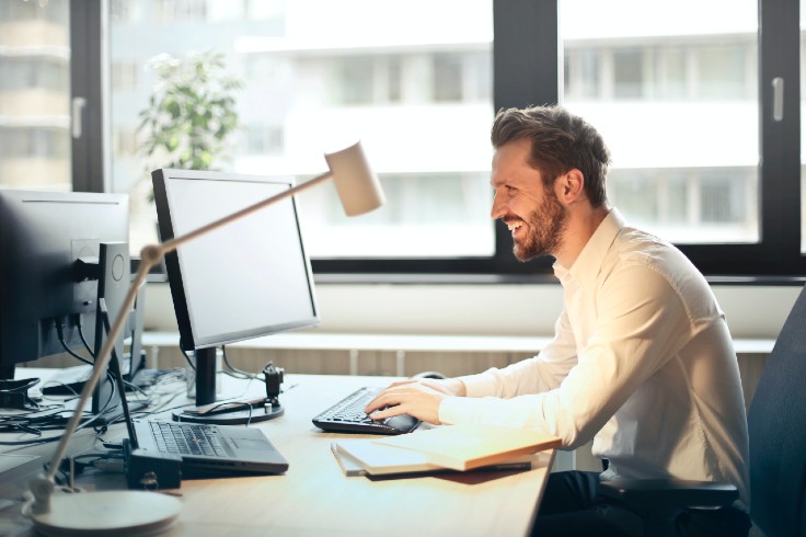 man-in-white-dress-shirt-sitting-on-black-rolling-chair.jpg